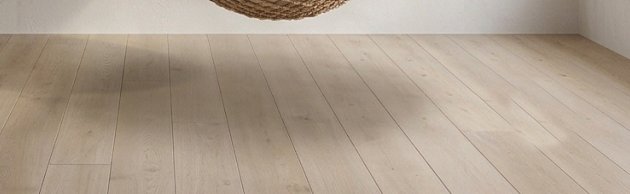 Floor with two overlapping shadows pointing different ways.